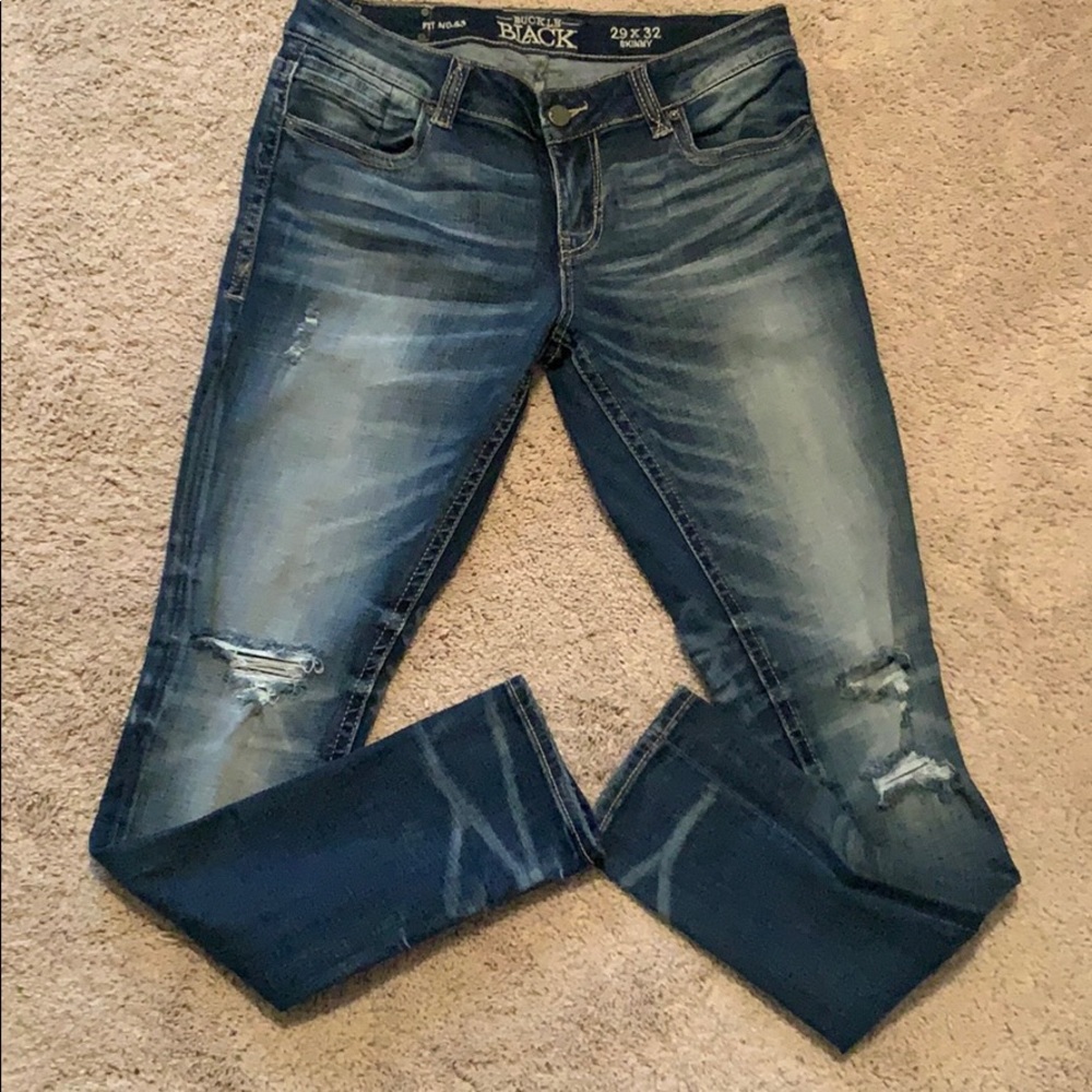 Buckle black skinny jeans